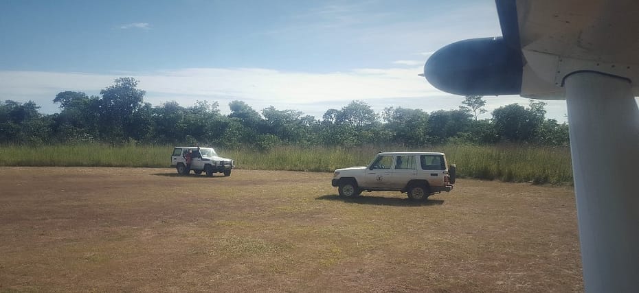 Two land rovers on an airstrip in Zambia