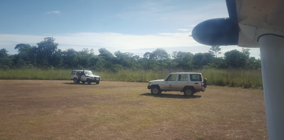 Two land rovers on an airstrip in Zambia