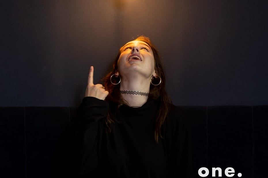 Alex Proctor pointing up at a light bulb